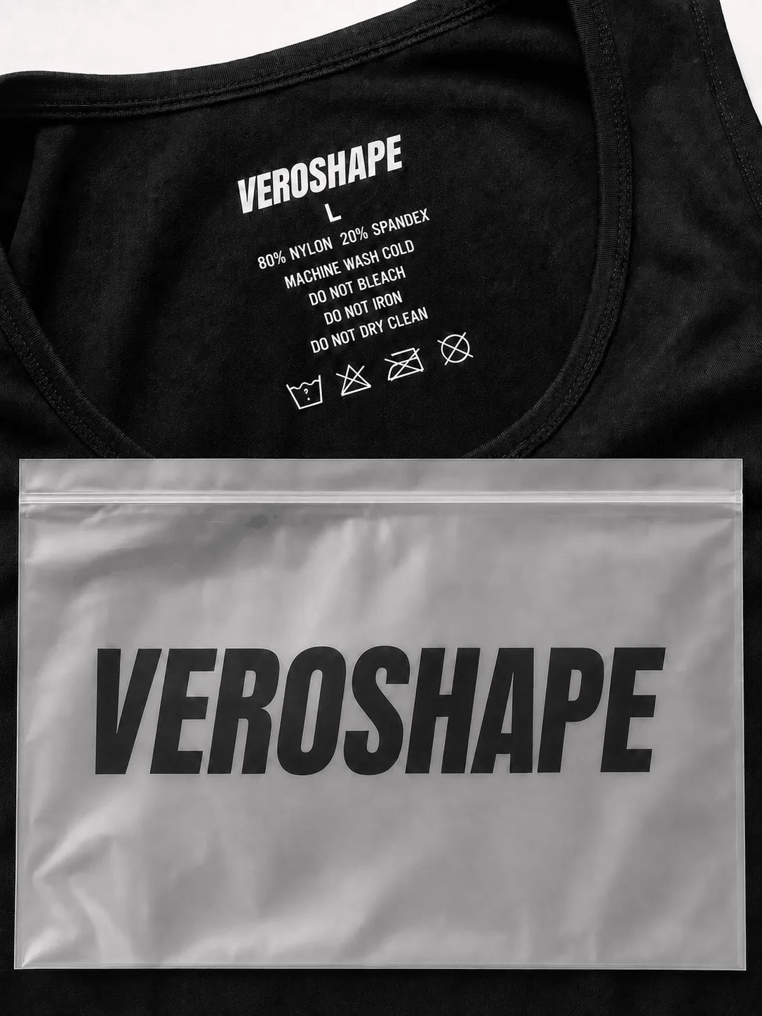 Close-up of the black VEROSHAPE men's compression tank top with size L heat-transfer care label, 80% nylon and 20% spandex composition, and branded frosted packaging pouch.